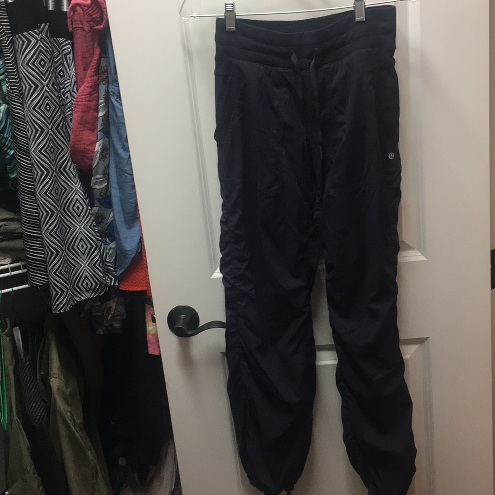 Size 4 Lululemon navy pants with ankle ties.
